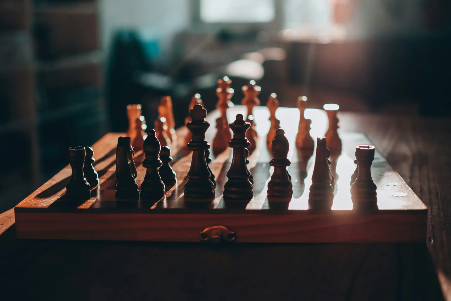 Chess pieces set up on a board